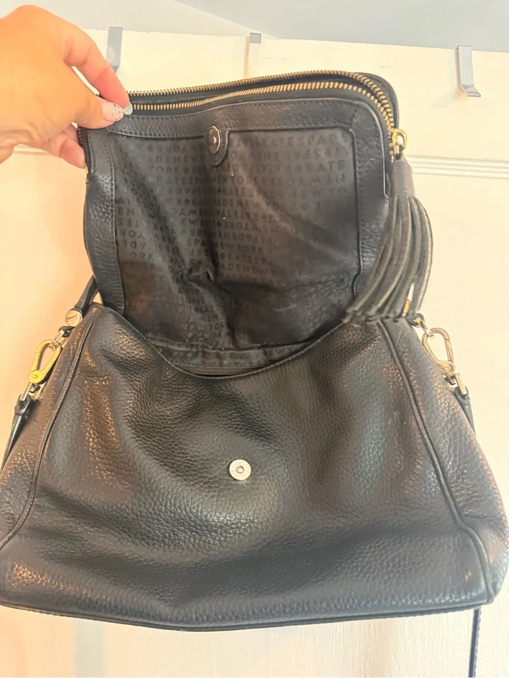 kate spade black pebbled leather shoulder bag with tassel